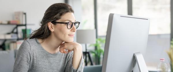 a woman with her hands on her chin