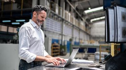 A man looking at A laptop